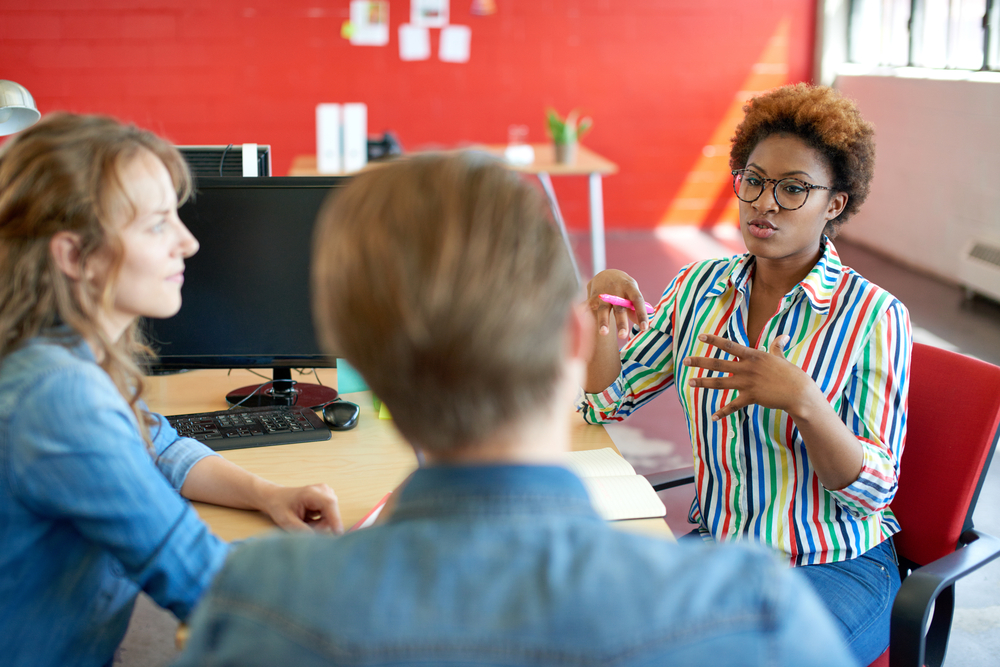 Black Woman Speaking in Group